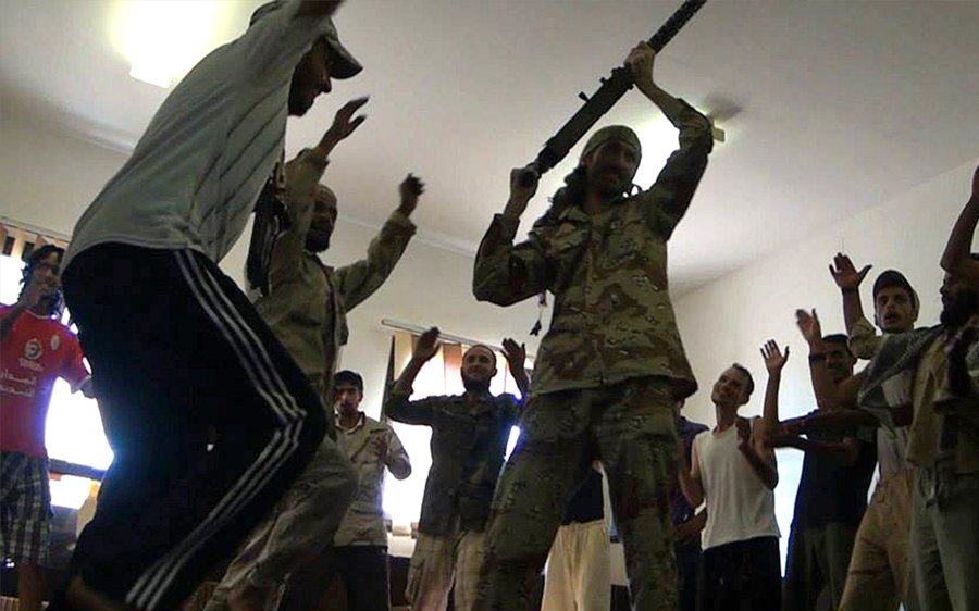 Fighters raising their arms and dancing in a crowded room